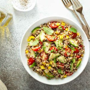 Fresh quinoa tabbouleh salad with tomatoes and cucumbers