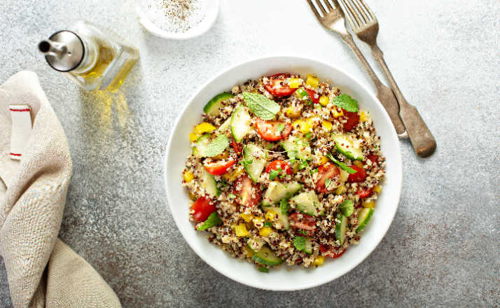 Fresh quinoa tabbouleh salad with tomatoes and cucumbers