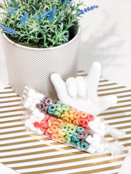 plant, i love you hand, rainbow treats on gold and white background