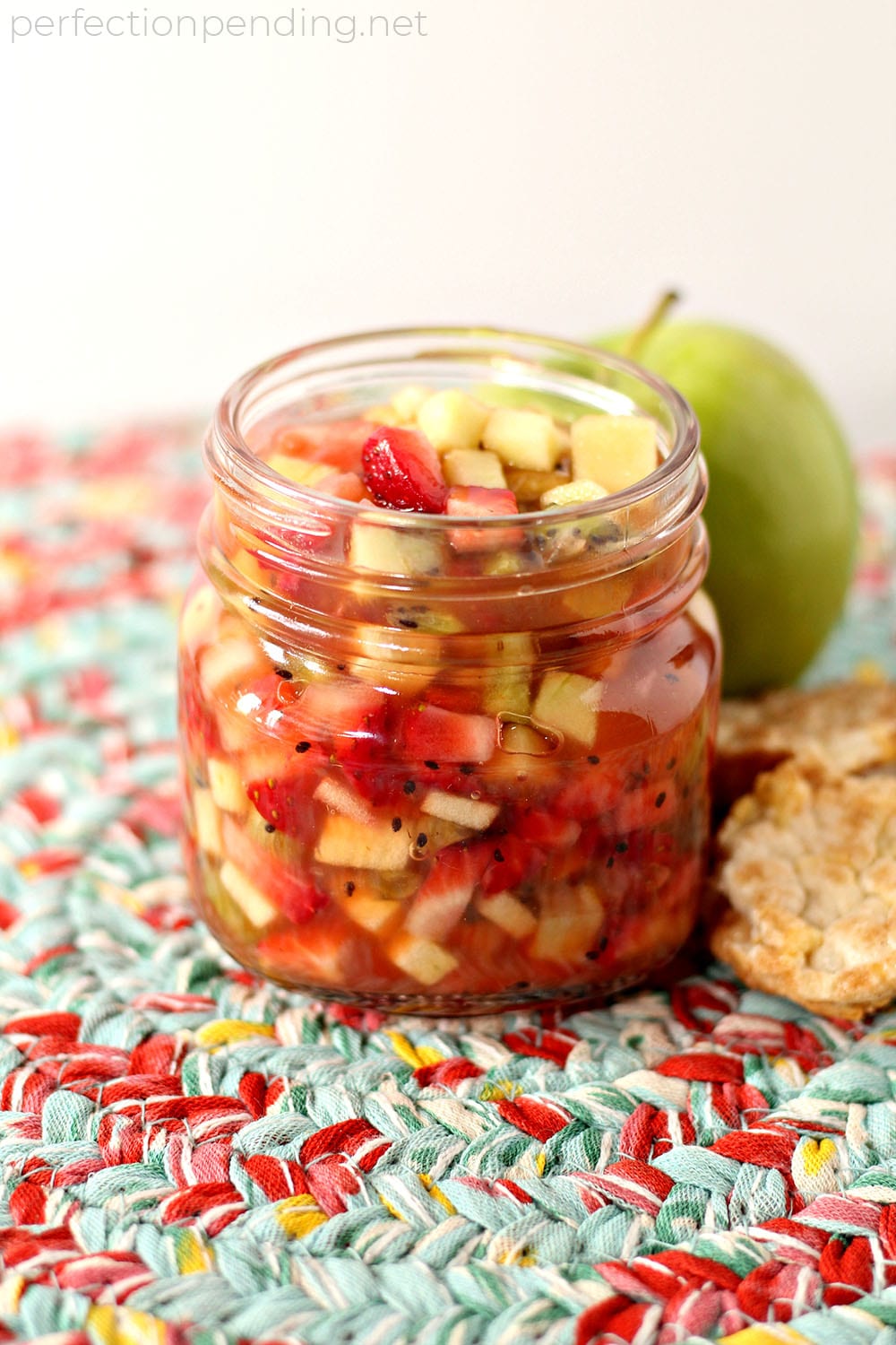 This apple berry summer salsa is the PERFECT treat for the end of summer. It's sweet, refreshing, and soooo delicious! If you're looking for an easy fruit salsa recipe - you'll want to try this. It's a healthy fruit salsa everyone will love. Perfect for last minute barbecues, summer parties, playdates, and even birthdays. #fruit #fruitsalad #summerrecipe #summer #appleberrysalsa #summersalsa #sweetsalsa