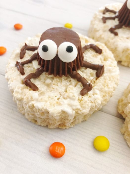 These Easy Spider Rice Krispie Treats made with reeses peanut butter cups are the perfect non-scary Halloween treat idea. With Silly candy eyes and your favorite rice krispies, these make a fun and easy halloween party treat. #halloween #halloweenparty #halloweenpartytreats #halloweenpartyideas #nonscaryhalloweentreats #halloweentreat #halloweenricekrispie