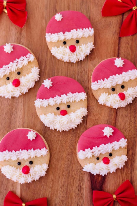 These santa sugar cookies are so easy to make and are the perfect Christmas cookie to give out to neighbors and friends, or to just make for fun at home. #christmascookie #christmascookies #santacookies #santasugarcookies #sugarcookierecipe #cookierecipe 