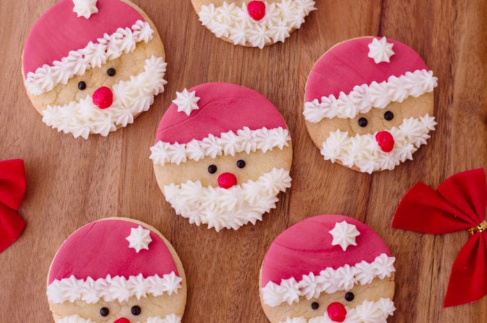 These santa sugar cookies are so easy to make and are the perfect Christmas cookie to give out to neighbors and friends, or to just make for fun at home. #christmascookie #christmascookies #santacookies #santasugarcookies #sugarcookierecipe #cookierecipe 