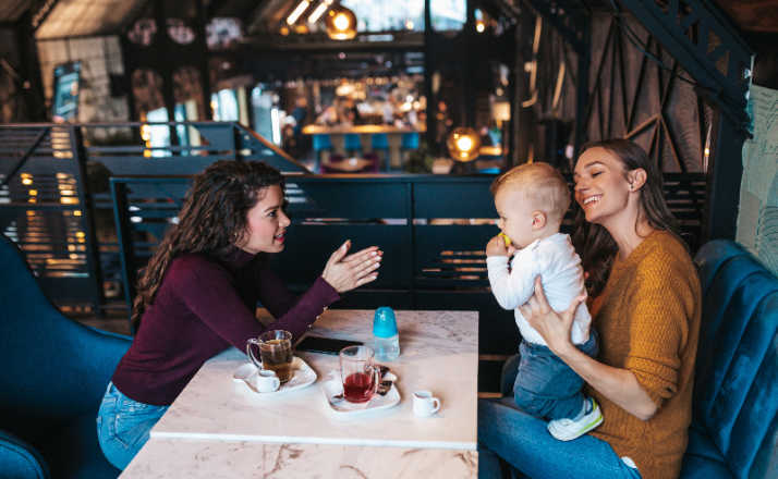 two mom friends enjoying coffee